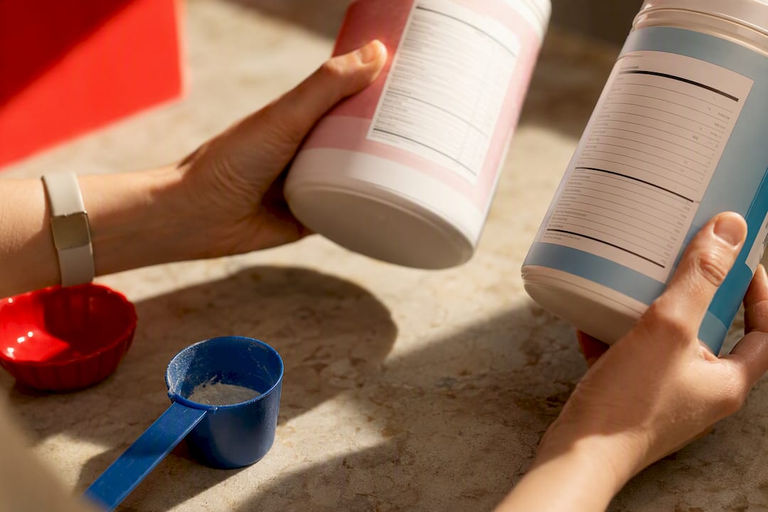 Hands comparing anonymous collagen protein labels