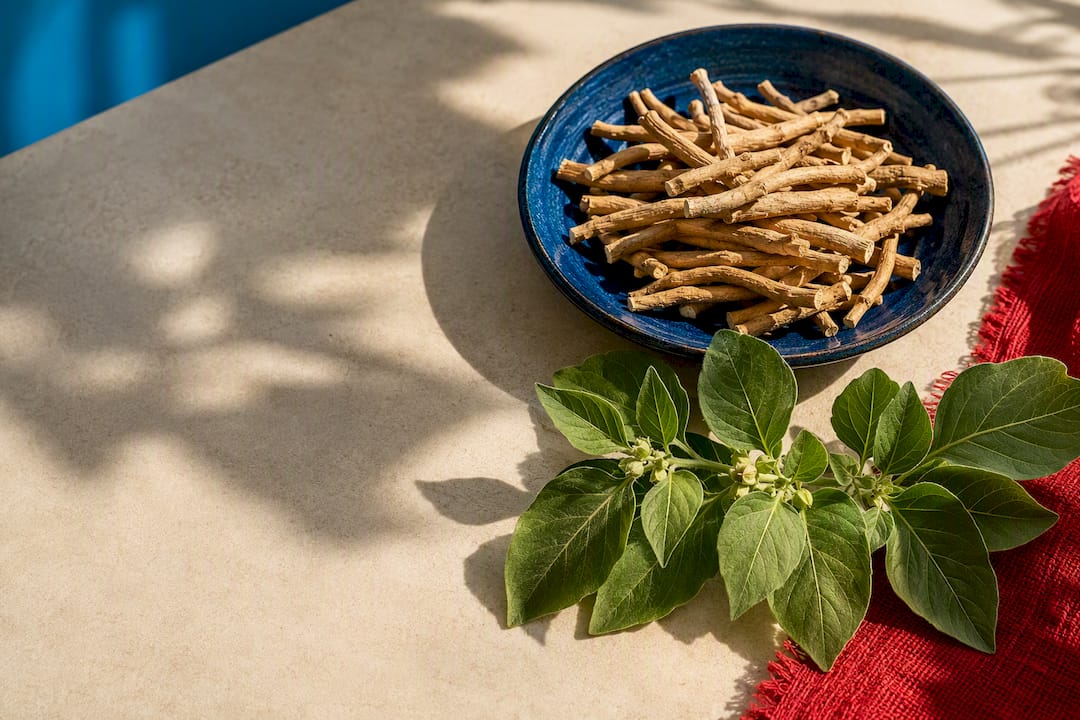 Ashwagandha roots and leaves on cream surface