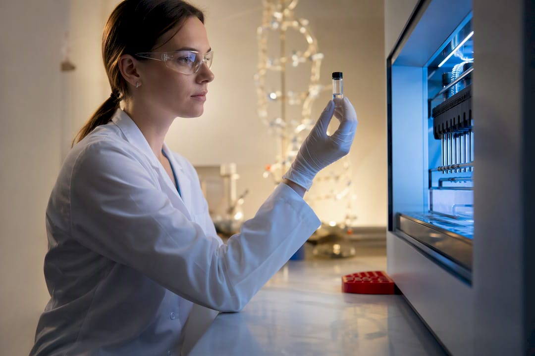 Scientist examining collagen sample in laboratory
